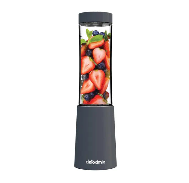 Mini Blender Detoximix gris avec des fruits entiers pour illustration