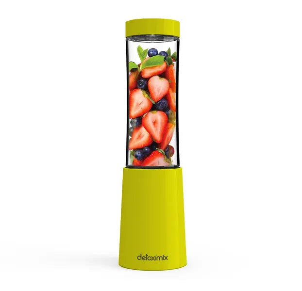 Mini Blender Detoximix vert avec des fruits entiers pour illustration